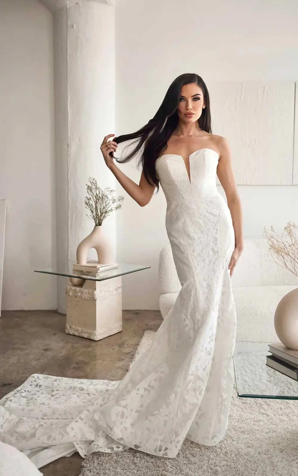 model is wearing a strapless bridal gown