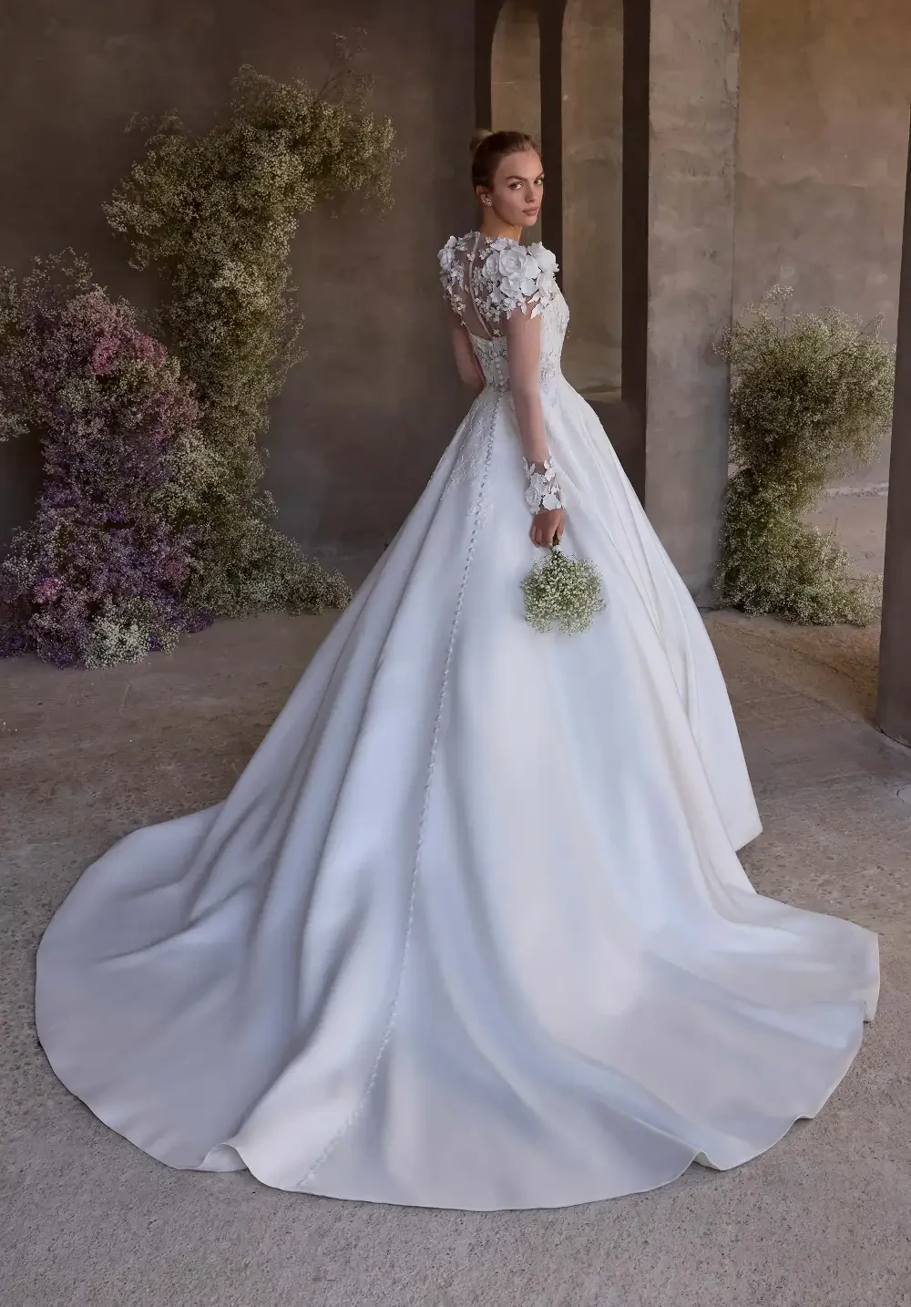 model is wearing a ball gown wedding dress
