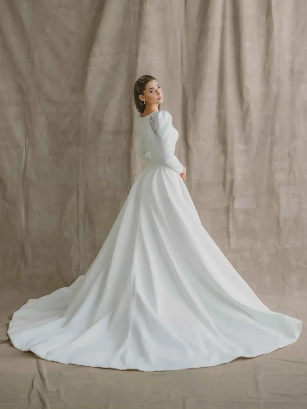 model is wearing a bold a-line wedding dress