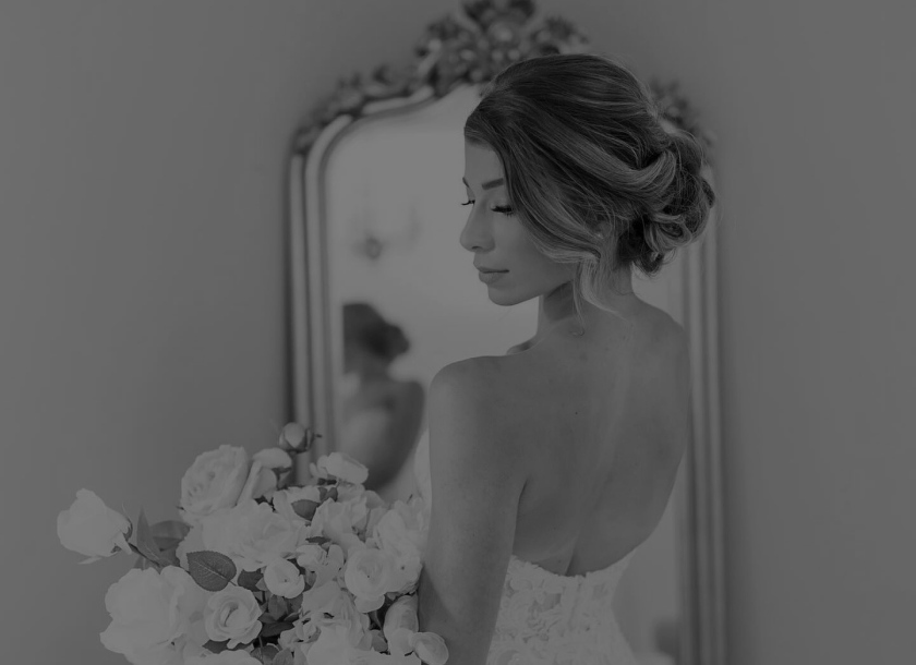 Photo of the posing model wearing a bridal gown
